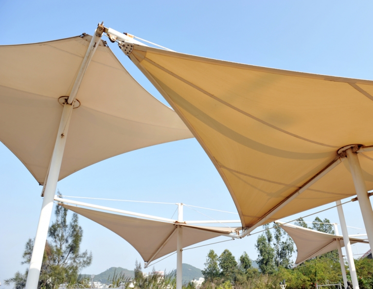 Shade sails protecting an outdoor space from the sun